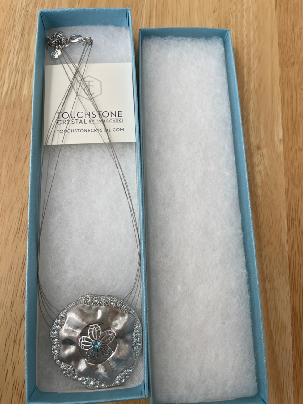 Touchstone Crystal Silver Flower Pendant Necklace with Blue Crystal Accent